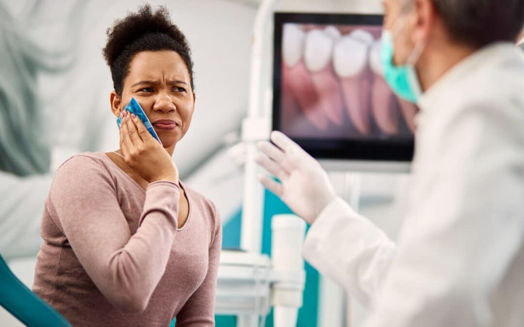 A womanholding her jaw due to dntal swelling and pain at 110 dental and Orthodontics in Whitehouse, TX